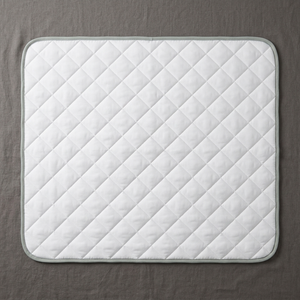 BESIDE bed layer laid flat, overhead view