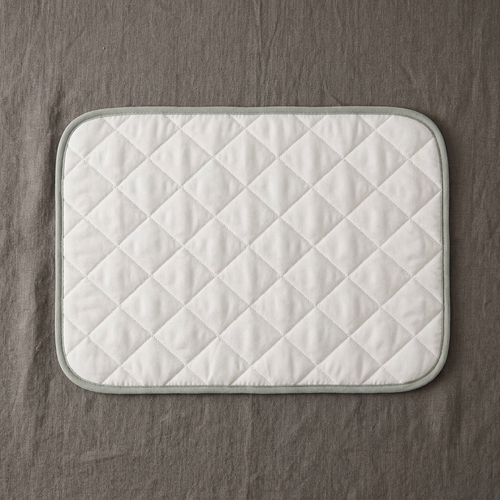 The BESIDE Car and Crate Layer, quilted with sage binding